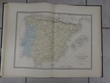 an open book with a map of spain on it sitting on a tiled floor