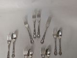 a lot of forks and spoons arranged in a circle