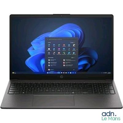 the laptop is open on a white background with a blue background