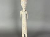 an image of a statue of a person with a hat on it ' s head