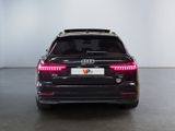 the rear end of a black audi suv parked in a garage