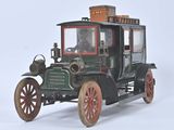 an old model of a car with a basket on top