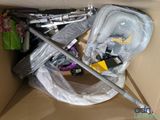 a cardboard box filled with assorted items and tools