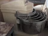 a mixer in a room with a table and a chair