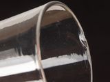 a close up of a glass of water on a table