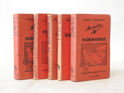 three red books sitting on top of each other on a white surface