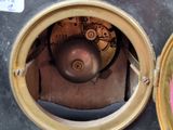 a close up of a clock that is on a table