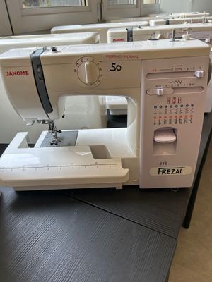 a sewing machine sitting on a table in a room
