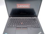 a laptop that has a lenovo logo on the screen