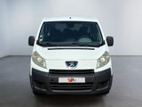 the front view of a white van parked in a white room
