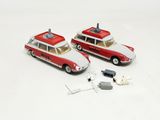 two toy cars that are sitting next to each other