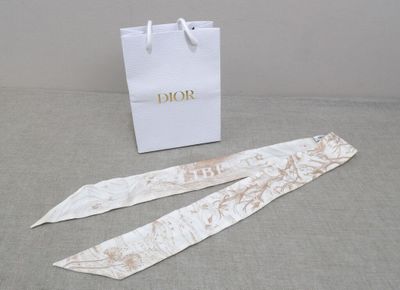 a white bag and two ties sitting on a table