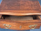 a small wooden box with a drawer inside of it