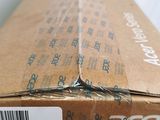 a cardboard box with a sticker on the side of it
