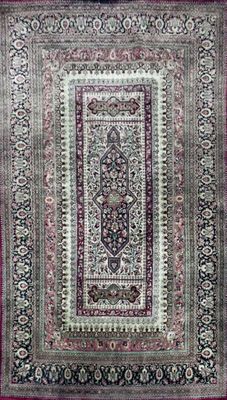 an oriental rug with a pink border and a black border