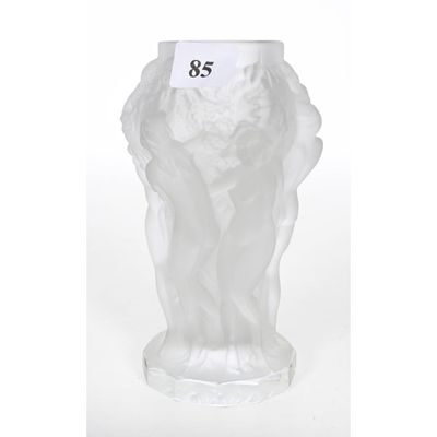 a glass vase with a label on it that says 85