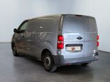 a silver van that is parked in a room