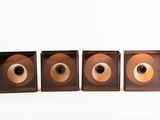 three speakers that are sitting next to each other on a table