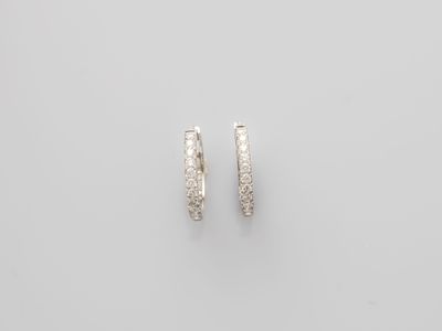 a pair of diamond hoop earrings