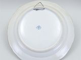 a white plate with a blue and white design on it