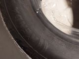 a close up of a tire on a white surface