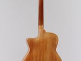 a close up of a guitar hanging from a string