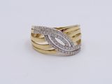 a close up of a gold and diamond ring on a white surface