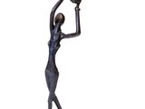 statue of a woman holding a bird on her arm