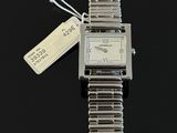 an image of a silver wrist watch with a tag on a black surface