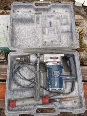 a tool in a case sitting on a wooden bench