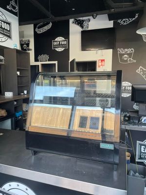 an image of a coffee shop with a display case