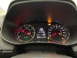 a close up of a car dashboard with a speedometer and gauges