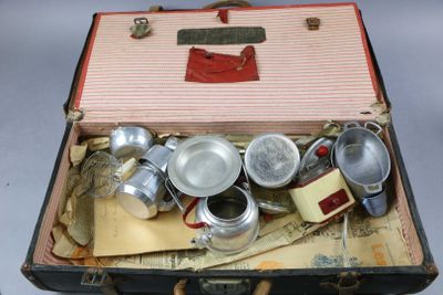 an open suitcase with a bunch of items inside of it