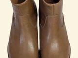 brown leather boots on a white background with a white background