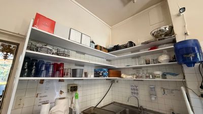 a kitchen with a sink and a stove in it