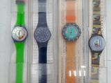 three different watches in the packaging on the table