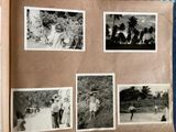 an old photo of a group of people on a beach with palm trees