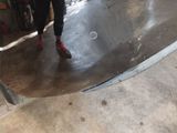 a man that is standing on a skateboard in a room