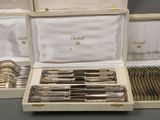 a box with silverware inside of it on a table