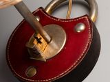 a close up of a lamp with a padlock on it