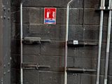 a fire extinguisher next to a fire hydrant in a building