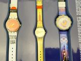 three watches that are in a box on a table