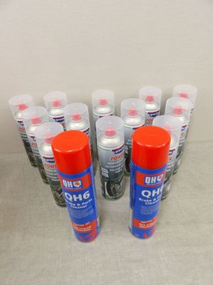 six cans of glue sitting on top of a table next to each other