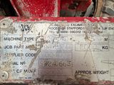 a close up of a red tractor with a label on it