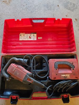 an image of a red tool box with tools inside of it