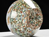 a glass ball that is sitting on a table