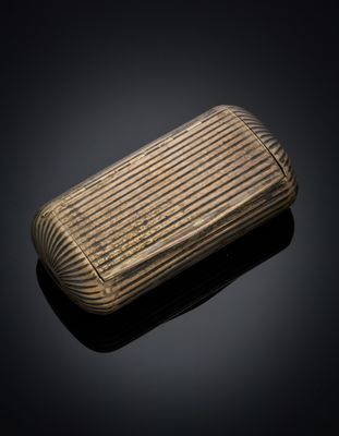 a close up of a wooden cigarette case on a black surface