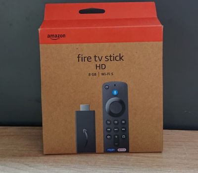 a box that has a remote in it on a table
