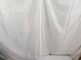 a close up of a white table with a white cloth on it