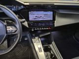 the interior of a car with a steering wheel, dashboard, and display screen